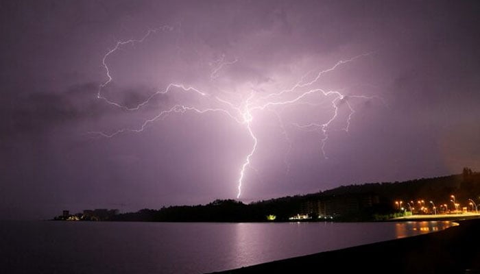 Lightning strikes are seen above Villarrica lake, in Villarrica, Chile, December 7, 2021. — Reuters