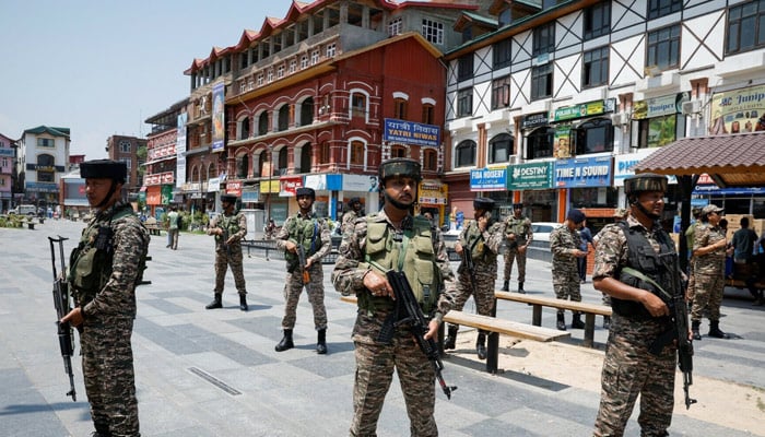 Indian security personnel stand guard on a street during the sixth anniversary of the revocation of Jammu and Kashmir’s special status in IIOJKs Srinagar on Aug 5, 2025. — Reuters