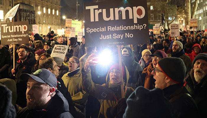 Demonstrators hold placards during a protest against US strikes against Venezuela and the capture of Venezuelan President Nicolas Maduro, in London, Britain, January 5, 2026. — Reuters