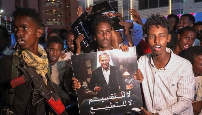 Somalis hold an image depicting Israeli Prime Minister Benjamin Netanyahu during a demonstration after Israels recognition of self-declared Somaliland as an independent and sovereign state, in Hodan district of Mogadishu, Somalia, December 28, 2025. — Reuters
