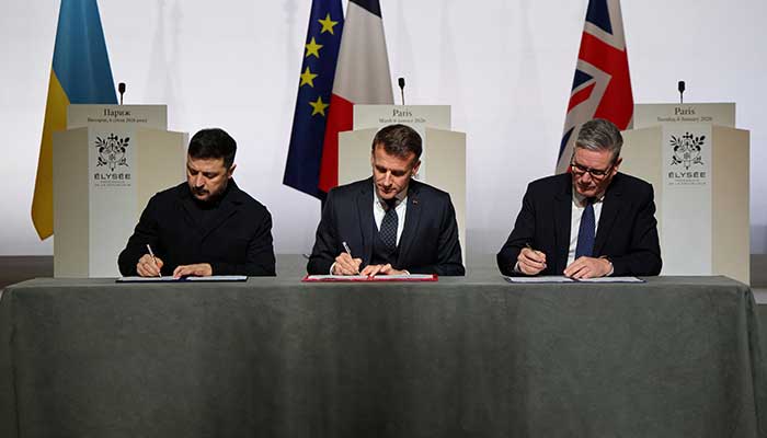 Ukraines President Volodymyr Zelensky, Frances President Emmanuel Macron and Britains Prime Minister Keir Starmer sign the declaration on deploying post-ceasefire force in Ukraine during the so-called Coalition of the Willing summit, at the Elysee Palace in Paris, France, January 6, 2026. — Reuters