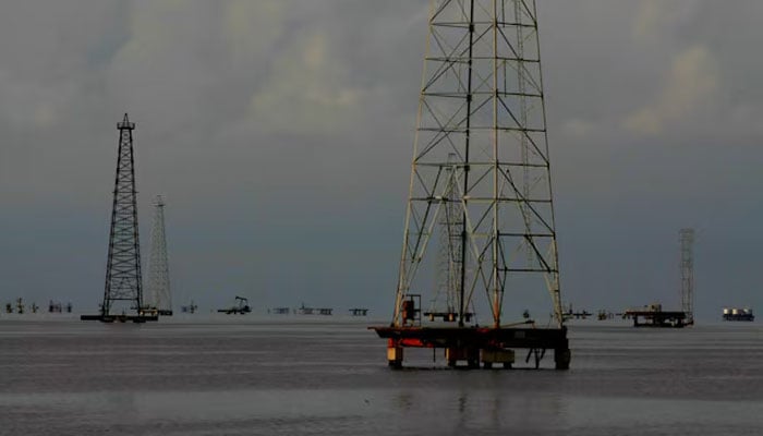 Pumpjacks are seen at Lake Maracaibo in Cabimas, Venezuela October 5, 2017. — Reuters