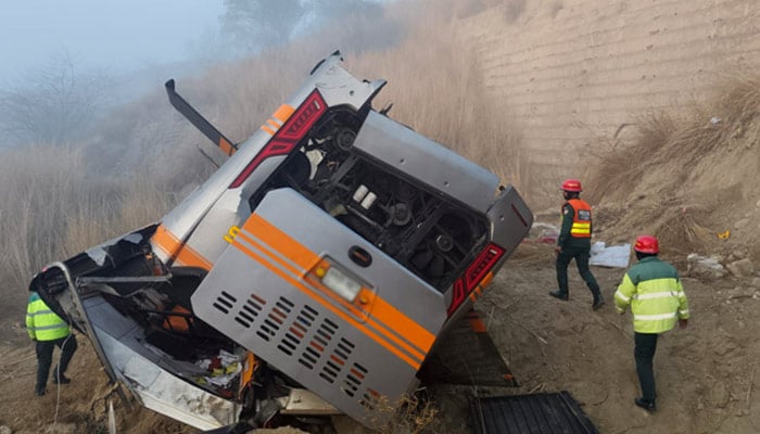 Rescue workers inspect an overturned vehicle after an accident near Talagang on January 7, 2026. — Reporter