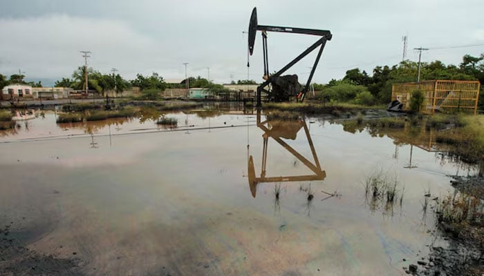 An oil pump jack is seen in an oil field near Lake Maracaibo, in Cabimas, Venezuela on October 14, 2022. — Reuters