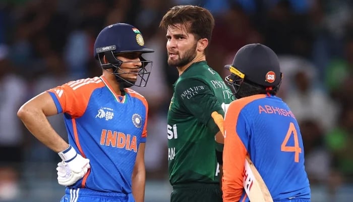 Shaheen Shah Afridi of Pakistan speaks to Indias Abhishek Sharma and Shubman Gill during their Asia cup match at Dubai International Stadium on September 21, 2025 in Dubai, UAE. — AFP