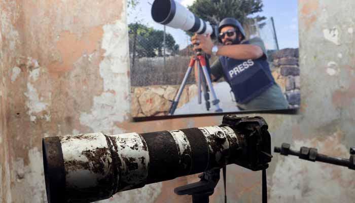 The camera that belonged to Reuters journalist Issam Abdallah who was killed on October 13 by what a Reuters investigation has found was an Israeli tank crew, is displayed during a press conference by Amnesty International and Human Rights Watch, in Beirut, Lebanon, December 7, 2023. — Reuters