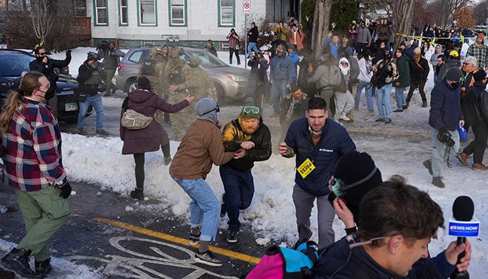 Members of the community and media take cover as Border Patrol agents use chemical irritants to disperse a crowd trying to prevent them from leaving the scene where a driver was shot by a U.S. immigration agent, according to local and federal officials, in Minneapolis, Minnesota, US, January 7, 2026. — Reuters