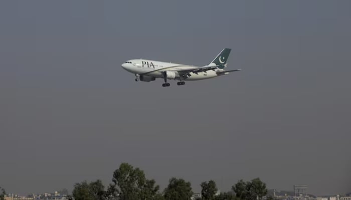 A Pakistan International Airlines (PIA) passenger plane arrives at the Benazir International airport in Islamabad, Pakistan, December 2, 2015. — Reuters