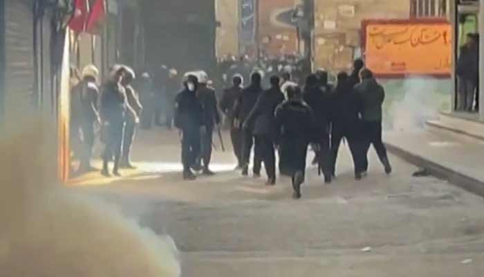 Iranian security forces using tear gas to disperse demonstrators in the Tehran bazaar on January 6, 2026. — AFP