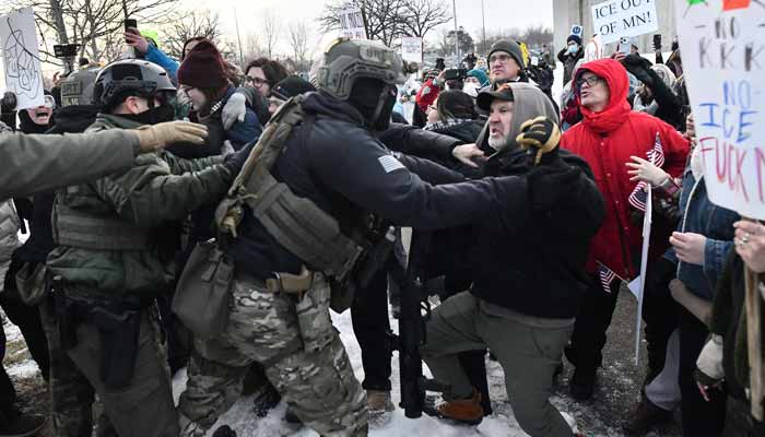 Protestors clash with federal agents outside the Bishop Henry Whipple Federal Building in Saint Paul, Minnesota, January 8, 2026. — AFP