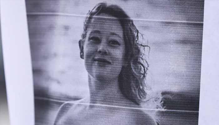 A picture of Renee Nicole Good is displayed near a makeshift memorial for Good, who was shot and killed at point blank range on January 7 by a US Immigration and Customs Enforcement (ICE) agent, in Minneapolis, Minnesota, January 8, 2026. — AFP