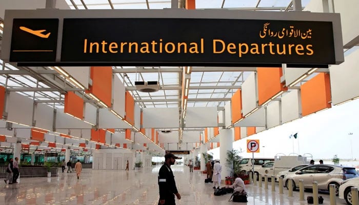 A worker walks at the departure area of the Islamabad International Airport, on April 18, 2018. — Reuters