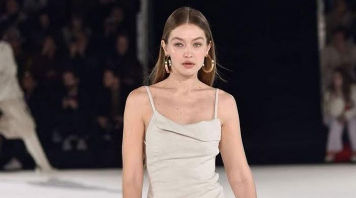 Gigi Hadid trades signature blondes with new look: See