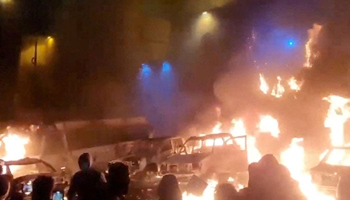 Protesters gather as vehicles burn, amid evolving anti-government unrest, in Tehran, Iran, in this screen grab obtained from a social media video released on January 9, 2026. — Reuters