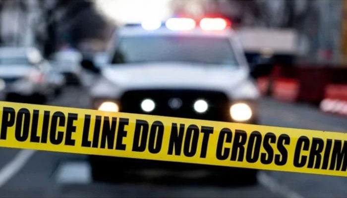 Representational image showing a police vehicle and a crime scene tape. — AFP