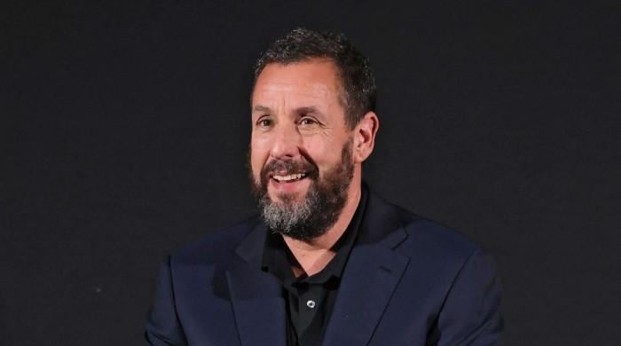 Adam Sandler makes fun of his age while receiving AARP Award