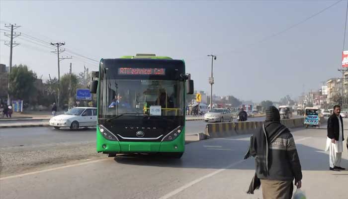 An electric bus arrives at a bus terminal in Jhelum. — Screengrab via X/@BilalAKayani