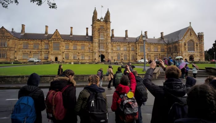 Representational image of visitors take pictures of the main building at the University of Sydney in Australia, August 5, 2016. — Reuters