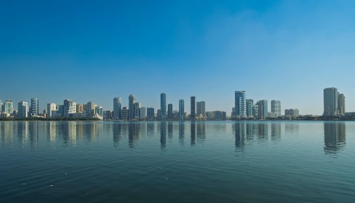 Image shows the skyline of Sharjah, UAE. — Pexels