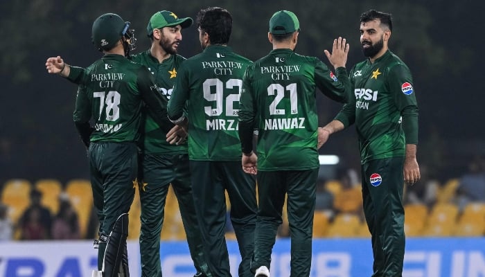 Pakistans Shadab Khan (R) celebrates with teammates after taking the wicket of Sri Lankas Dhananjaya de Silva during the first Twenty20 international cricket match between Sri Lanka and Pakistan at the Rangiri Dambulla International Stadium in Dambulla on January 7, 2026. — AFP