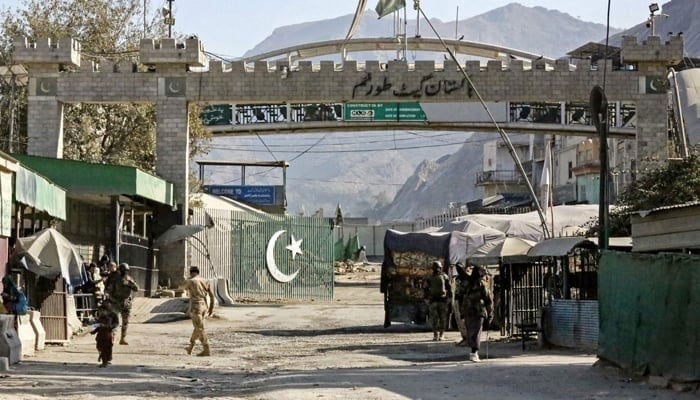 order security personnel of Afghanistan and Pakistan stand guard at the zero point Torkham border crossing between the two countries, in Nangarhar province on January 15, 2024. — AFP