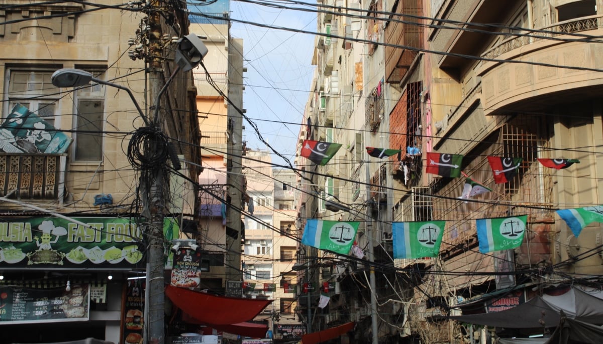 A street in Karachis Saddar area is decorated with flags of PPP and JI. — Instagram/@umersheikhphoto