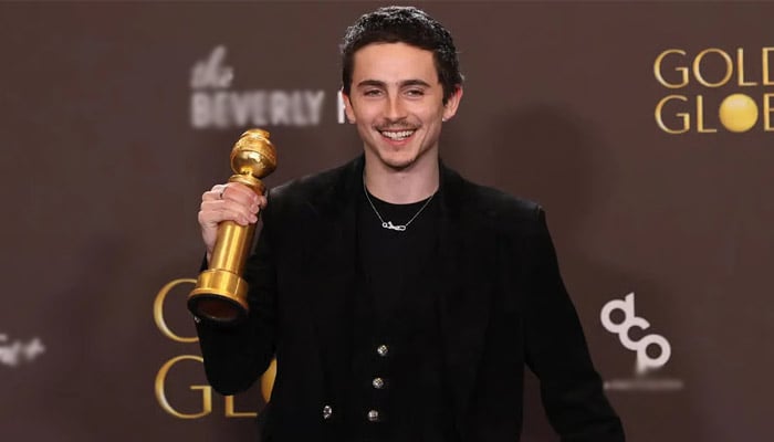 Timothée Chalamet can’t get enough of first Golden Globe trophy