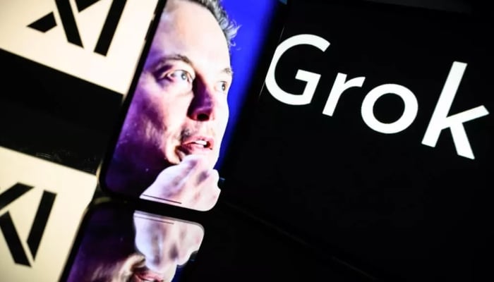 Elon Musks picture displayed besides screens showing Grok and XAI logos. — AFP
