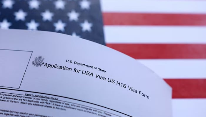 US flag and US H-1B Visa application form are seen in this illustration taken September 26, 2025. — Reuters