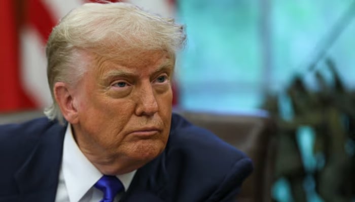 US President Donald Trump looks on as he signs executive orders and proclamations in the Oval Office at the White House, in Washington, DC on May 5, 2025. — Reuters
