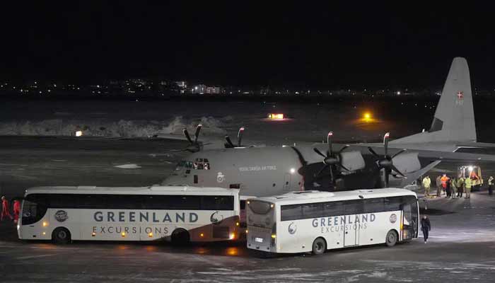 A Royal Danish Air Force plane carrying personnel in military fatigues lands at Nuuk airport Greenland, January 14, 2026. — Reuters