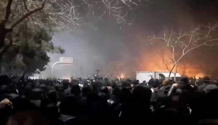 Smoke rises as protesters gather amid evolving anti-government unrest at Vakilabad highway in Mashhad, Razavi Khorasan province, Iran. — Reuters