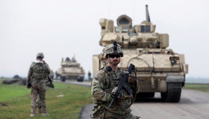 A soldier from the US-led coalition stands guard during a joint US-Kurdish-led Syrian Democratic Forces (SDF) patrol in the countryside of Qamishli in northeastern Syria, February 8, 2024. — Reuters