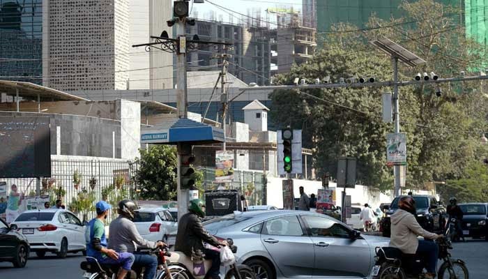 View of traffic cameras part of Intelligent Traffic System (ITS) to support the e-challan (Tracs) system, at PIDC Chowk in Karachi on December 2, 2025. — PPI