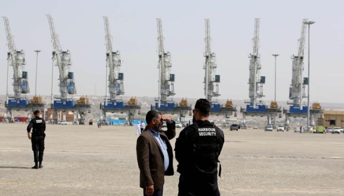 Harbour security men stand guard at Shahid Beheshti Port in the southeastern Iranian coastal city of Chabahar, on the Gulf of Oman. — AFP/File