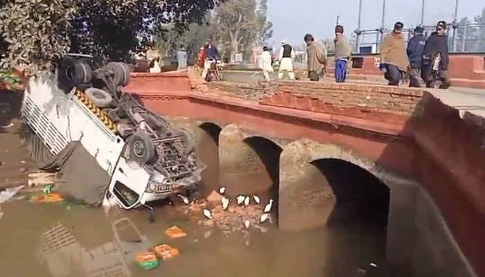 This image shows a truck that fell from a bridge into a canal in Sargodha on January 17, 2026. — Reporter