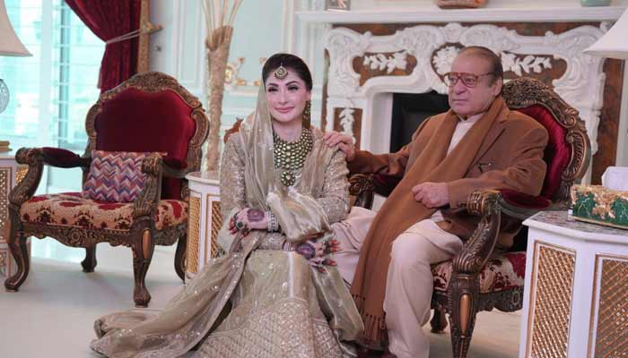 Former premier Nawaz Sharif poses with Punjab Chief Minister Maryam Nawaz during wedding ceremony of grandson Junaid Safdar at Jati Umra, Lahore, on January 17, 2026. — Instagram/irfanahson