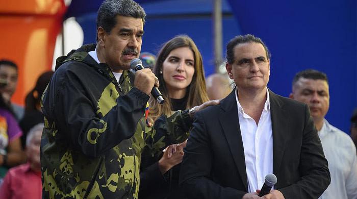 Venezuela interim leader sacks industry minister allied with ousted president Maduro