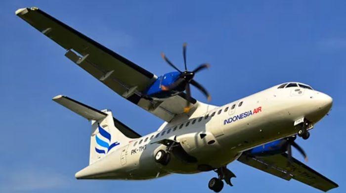 Debris spotted on mountainside in hunt for plane missing with 11 in Indonesia