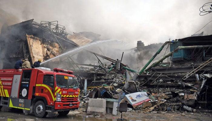 Fire fighters douse Gul Plaza fire to control a fire which broke out at Gul Plaza shopping centre in Karachi on January 18, 2026. — Online