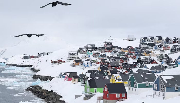 Seagulls fly over the old city of Nuuk, Greenland, March 29, 2025. — Reuters
