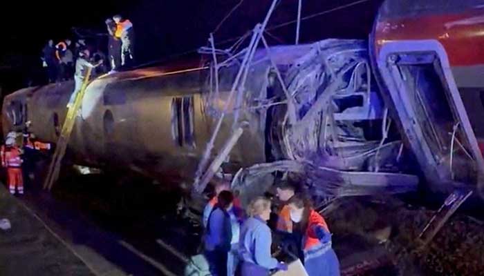 First responders search through wreckage after two high-speed trains derailed in Adamuz, near Cordoba, Spain, January 18, 2026. — Reuters