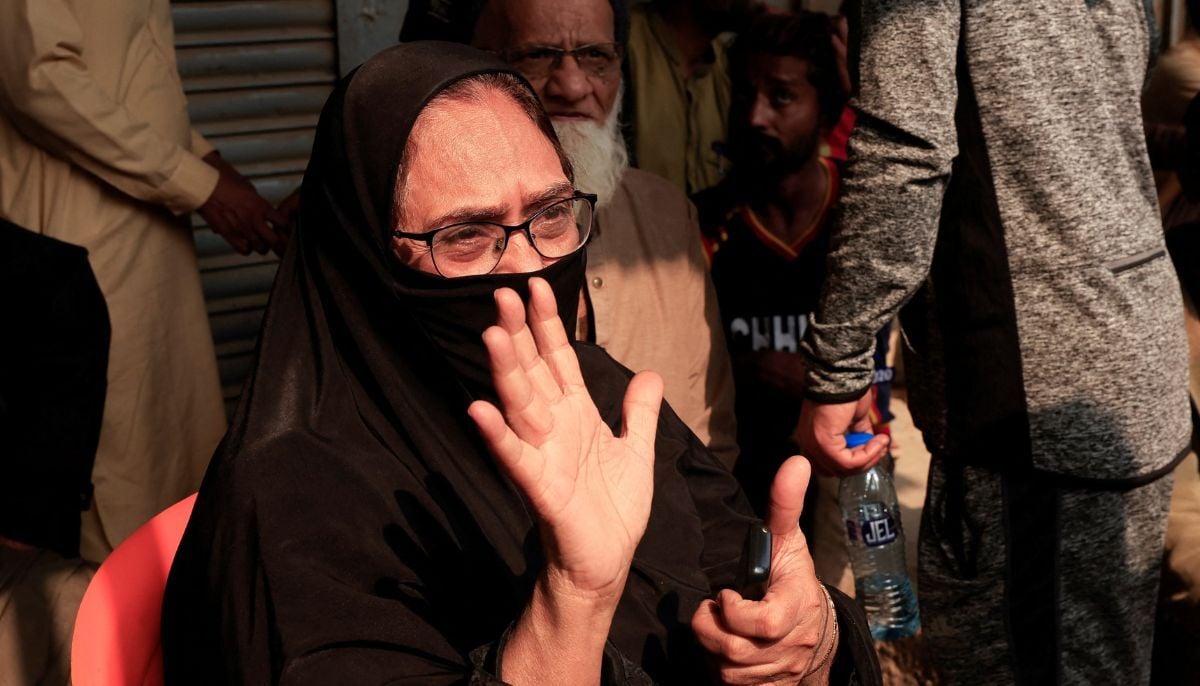 A woman speaks to reporters (not pictured) as she mourns six missing family members who were there shopping for a wedding ceremony, following a massive fire that broke out in the Gul Plaza Shopping Mall in Karachi, January 19, 2026. — Reuters