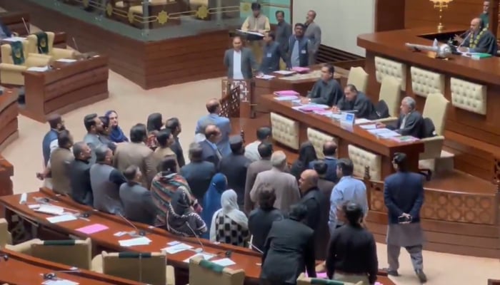 Muttahida Qaumi Movement-Pakistan lawmakers stage a protest in front of the speakers desk in the Sindh Assembly, Karachi, January 19, 2026. — Screengrab via X/@MQMPKOfficial