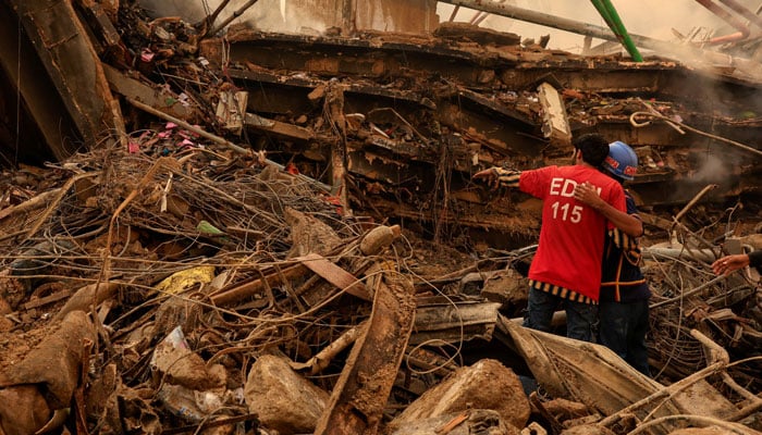 Rescue workers search for survivors, following a massive fire that broke out in the Gul Plaza Shopping Mall in Karachi, January 19, 2026. —Reuters