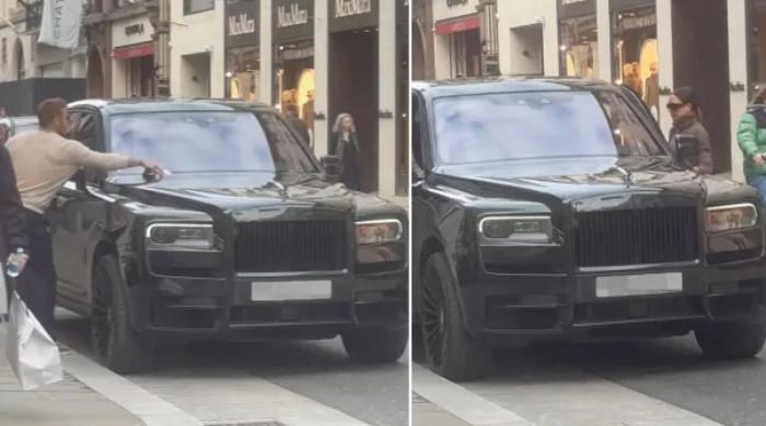 David Beckham snapped removing parking ticket after shopping spree