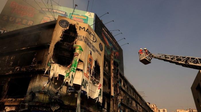In pictures: Smoke, rubble and grief after Gul Plaza blaze