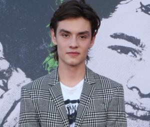 Louis Partridge shaves his head despite family's pleas: 'Post-breakup hair'