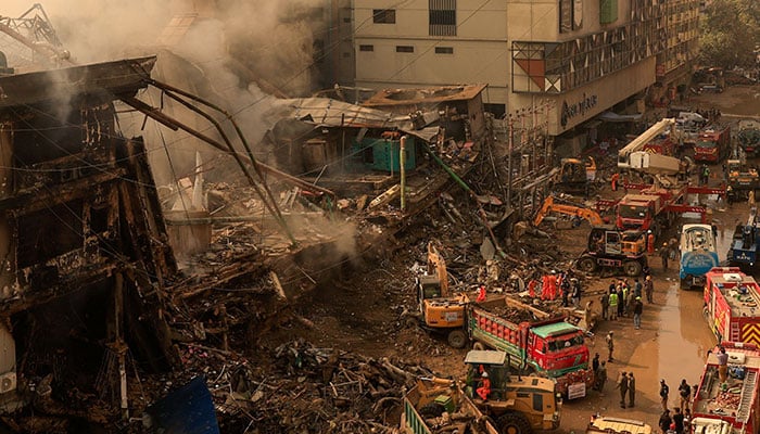Rescue workers use heavy machinery to remove rubble, following a massive fire that broke out in the Gul Plaza Shopping Mall in Karachi, Pakistan, January 19, 2026. — Reuters
