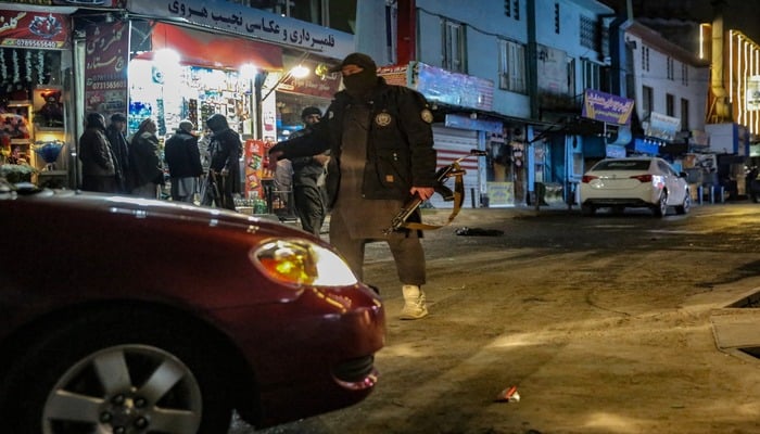 Taliban security personnel stand guard at a blast site following an explosion in the Shahr-e Naw area of Kabul on January 19, 2026. — AFP